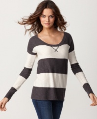 Top off a casual pair of jeans with Kensie's striped sweater. Laid-back with a slim silhouette, this closet staple easily transitions from daytime to date night.