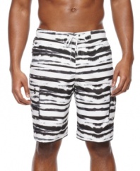 Wet and wild! Show off your vibrant personality with these attention-getting swim trunks from Izod.