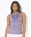 Rendered in light-as-air tissue cotton jersey, Lauren by Ralph Lauren's stylish sleeveless plus size top channels bohemian romance with eclectic paisley patterns, feminine ruffles and a chic keyhole detail.