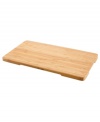 Regain lost counter space with this handy cutting board, crafted in bamboo wood to resist cuts marks and stand the test of time. Use it as a cutting board, trivet or serving tray with recessed side handles for easy movement. One-year limited warranty.