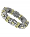 A natural selection. 2028's pretty bracelet feature a unique oval and floral pattern in silver and gold tone mixed metal. Bracelet stretches to fit wrist. Approximate diameter: 2-1/2 inches.