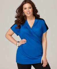 A cross front design lends a slimming shape to DKNYC's short sleeve plus size top, showcasing a colorblocked design.