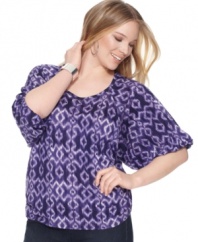 A bold print and a pop of color create a globally-glam effect! Try MICHAEL Michael Kor's plus size peasant top with jeans, capris, maxi skirts and more.