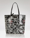 kate spade new york's ever-practical tote is dressed up in bold graphic stripes that might inspire a long jaunt or quick shopping trip.
