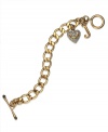 Show your love for Juicy Couture with this toggle bracelet featuring a glass stone embellished heart pendant and J-shaped pendant. Chain crafted in gold tone stainless steel. Charms crafted in gold tone brass. Approximate length: 8 inches. Approximate drop: 3/4 inch.