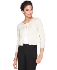 The perfect spring layer for a chilly night or a sleeveless look at the office, this petite T Tahari sweater features a fantastic cropped fit and a chic, minimalist ribbon detail at the neck.
