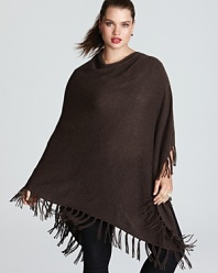 Transition into the new season by topping off your look with a lush layer. This C by Bloomingdale's Plus poncho is decorated by boho-chic fringe for the perfect touch of bohemian-chic.
