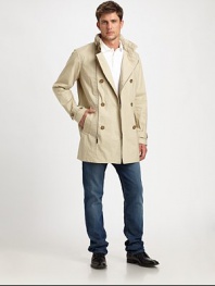 Traditional outerwear staple with modern details, takes this classic trench to the next level of style with zipper accents that are both versatile and functional.Zip frontSide slash pocketsRear ventPartial liningAbout 36 from shoulder to hemCottonDry cleanImported