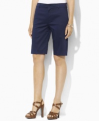 Designed for a flattering, slimming fit from lustrous stretch cotton sateen, these chic petite Bermuda shorts from Lauren by Ralph Lauren are the epitome of timeless, preppy style. (Clearance)