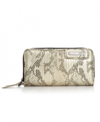 This petite python print clutch from Kenneth Cole Reaction will accentuate any outfit with instant edginess. Brushed metallic hardware and detail stitching add extra allure, while its precisely organized interior includes plenty of pockets and compartments for all your essentials.