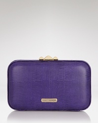 Don't shrink from bold accessorizing. This shapely clutch from Rebecca Minkoff is perfectly sized for the evening essentials, in a violet hue that is sure to standout.