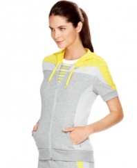 Warm up your workout in Puma's short-sleeved jacket. Colorblocked mesh panels recall sporty vintage styling -- so cool!