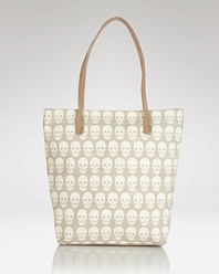 Hit print with this canvas tote from Treesje, splashed in an edgy skull motif. Hard-hitting yet practical, it's a style that's totally to die for.