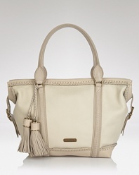 In soft, pale leather. this Burberry tote lends iconic style with modern details--whipstitched trim and oversized tassels lend forward flair.