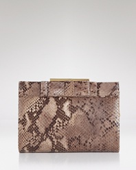 Take bold style out for the night with this python-embossed leather clutch from Badgley Mischka. Ideally sized for the essentials, it's destined to be your new party favorite.
