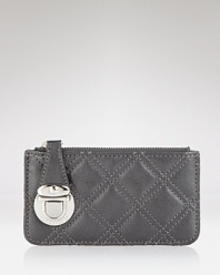 Make every accessory count with this key pouch from Marc Jacobs, flaunting the brand's signature quilted leather and metallic hardware.