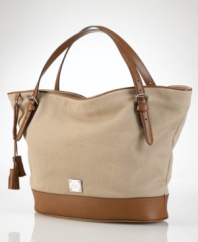 A perfect blend of cool, casual cotton canvas and rich leather accents, this roomy and versatile tote from Lauren by Ralph Lauren is an everyday essential infused with haute style.