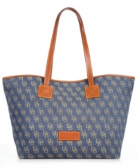 Toss in a laptop, evening wrap or almost anything you can't leave home without. This spacious silhouette from Dooney & Bourke carries your essentials with ease. Signature jacquard fabric and leather trim add graphic contrast, while plenty of pockets organize the interior.