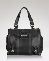 Let See by Chloé's ruffle-trimmed tote lend your look a girlie edge. To work a split personality head-to-toe, style this bag with a flouncy dress and pair of hard-hitting motorcycle boots.