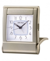 This elegant alarm clock from Seiko travels just as beautifully as it adorns any tabletop. Rectangular silvertone case. Square white dial with logo, numeral indices, alarm and snooze. Folds into a carrying case. Battery included. Measures approximately 3-3/8 x 2-5/8 x 1.