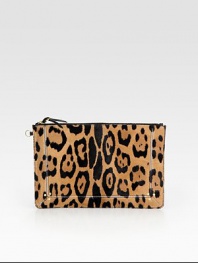 A smooth leather zipper accent is the perfect finishing touch on this ultra-chic compact shape of leopard-printed pony hair. Top zip closure with leather pullCotton lining11½W X 7½H X ½DImported