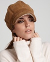 Exude classic cold-weather style with this cozy chestnut-hued shearling cap from UGG® Australia.