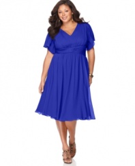 Dress the part in this beautiful plus size Suzi Chin dress with a flattering empire waist and flowing fit.