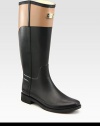Waterproof classic in an equestrian-inspired, two-tone design. Rubber heel, 1 (25mm)Shaft, 15Leg circumference, 14Rubber upperPull-on styleJersey liningRubber solePadded insoleImported