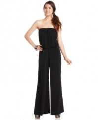All about volume, this jumpsuit from American Rag pairs a carefree blouson top with chic, wide leg pants!
