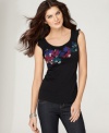 A burst of floral embroidery, highlighted by sequins and beading, gives this petite top by DKNY Jeans charming appeal. Rough-cut edges at the shoulders give a dash of edginess! (Clearance)