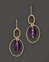 Faceted oval amethyst adds rich sparkle to links of 14K yellow gold. By Nancy B.