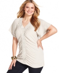 A ruched front lends a slenderizing look to Style&co.'s short sleeve plus size top, accented by crochet trim-- finish the outfit with your favorite jeans.