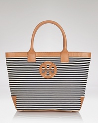 Tory Burch channels French chic with this roomy striped tote. Designed to be your new go-everywhere carryall in sturdy canvas with leather trims, it's sure to be the bag your reach for again and again.