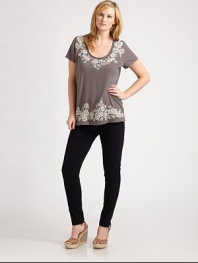 Pretty embroidery adorns the front and back of this cotton tee. The flattering scoopneck and elongated silhouette will flawlessly complement your curves.ScoopneckShort sleevesAbout 29 from shoulder to hemCottonMachine washImported