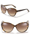 Look fierce in oversized cat eye sunglasses with gradient lenses and a spotted frame.