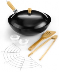Wok out! Introduce authentic Asian flavor into your kitchen. This wok set includes the essentials-nonstick wok with lid, soy sauce pots, bamboo spoon and more-for whipping up a delicious stir fry with all the fixings. A great way to incorporate healthy cooking into your weekly menu. 1-month warranty.