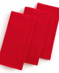 Grab style and keep function with a set of three kitchen towels that step forward in a bright color to wipe up spills, aid in prep and add an accent to your space. The textured design sets a sharp appearance for any room, while the highly absorbent terry quickly cleans up. Limited lifetime warranty.