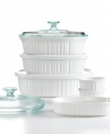Cook in classic form! This must-have set is made of durable stoneware designed for use virtually anywhere, letting you bake, serve and store in the same dish. The classic, fluted design creates an elegant presentation for any meal, complementing cuisine to delicious perfection. 1-year limited warranty.