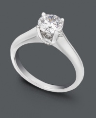 A timeless beauty symbolic of everlasting love. A sparkling round-cut solitaire diamond (9/10 ct. t.w.) sits in a shining 18k white gold setting. Ring features a single round-cut diamond (1/10 ct. t.w.) in a Milli-micro prong setting. IGI Certified diamonds.