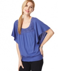 Flowing and fabulous, this petite top from Style&co. hits all the right notes for spring. A crochet-front yoke and bold color give it pop!