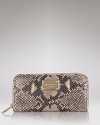 A glazed finish lends added luxe to this python-embossed leather wallet from MICHAEL Michael Kors.