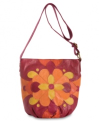 Get your groove on with this retro crossbody from Lucky Brand that'll give any look a lift. Plush leather patchwork in a kaleidoscope of color and geometric, floral pattern is altogether eye-catching, while strategically placed pockets make access to essentials a breeze.