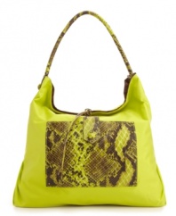 A casual nylon silhouette accented with a bold snakeskin print. This go-anywhere hobo will add a fiercely fun feel to any outfit. Bonus: this style is reversible!