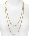 Small gold hammered discs adorn this extra long chain necklace with a faux openwork motif, making it the perfect refined bohemian piece to layer, double, or even triple. From Lauren Ralph Lauren.
