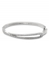 Demure enough for daytime yet equally elegant for evening, Swarovski's Hermine Bangle is a perfectly practical and versatile style. Crafted in silver tone mixed metal, it's adorned with glittering pavé crystals. Approximate length: 7-1/4 inches.