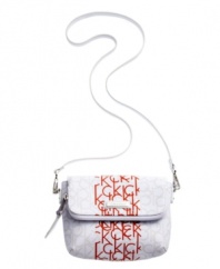 A vibrant pop of color adds a lively edge to this sleek Calvin Klein design. A monogram exterior decorates this travel-ready crossbody with shiny silvertone accents.