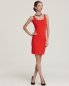 A minimalist silhouette is vibrantly offset by an electric hue on this curve-defining Susan Monaco dress.