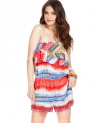 Score beach betty style in this vibrant romper from American Rag! Tiers of ruffles and a colorful print create tropical cool,  while a slouchy-chic fit calls for total relaxation!