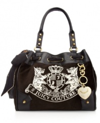 It's impossible to resist this ultra feminine silhouette from Juicy Couture that flaunts a flirty bow, bejeweled heart key chain and signature stitching. Discrete stud accents add extra dimension, while a well-organized interior with plenty of pockets keeps essentials safe and secure.