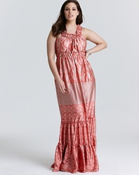 Tiers of patterned silk cascade the floor-length silhouette of this Melissa Masse Plus maxi dress for a head-turning statement. Complement the crimson color palette with gold garnishes.